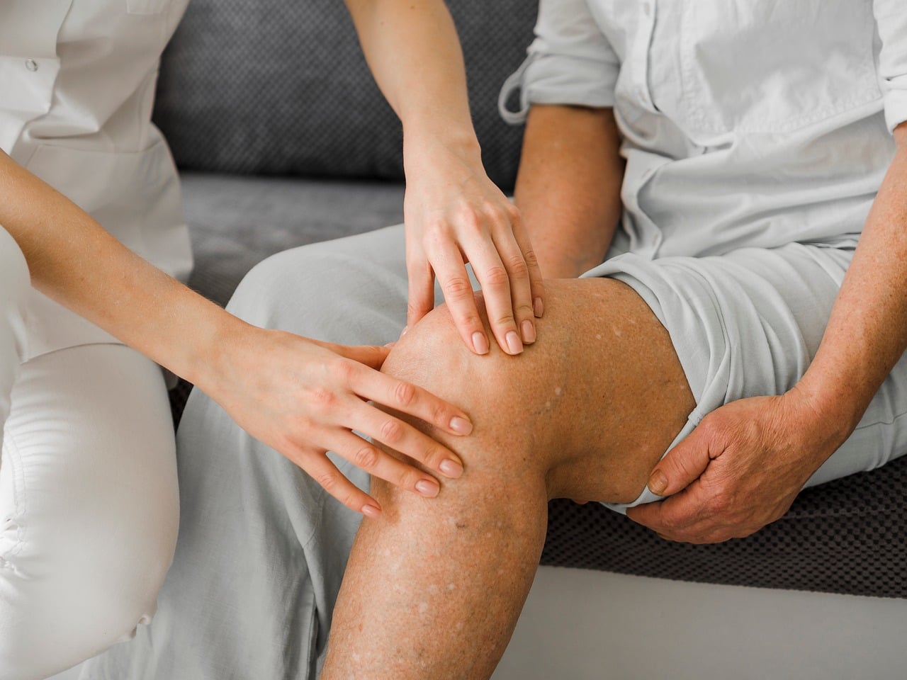 physiotherapist guiding patient exercise